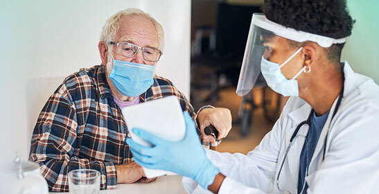 medical-professional-and-patient-reviewing-information-on-tablet